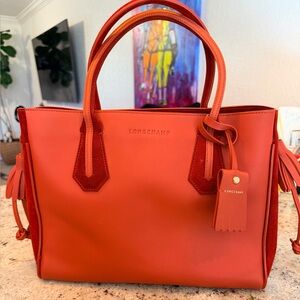 Longchamp “Penelope” Women's burnt red Medium Tote.